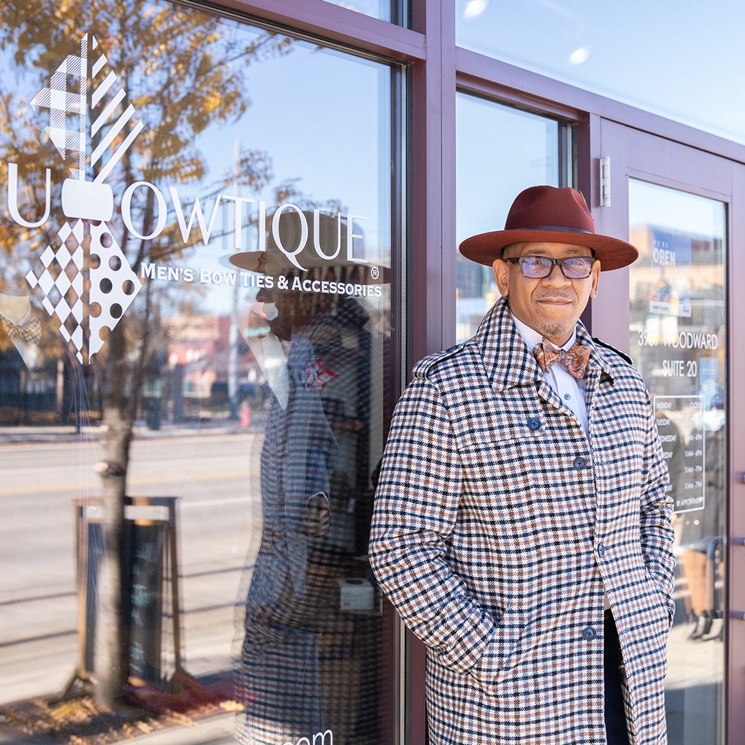 Ne'Gyle, the owner of Bleu Bowtique, stands outside his store in Detroit