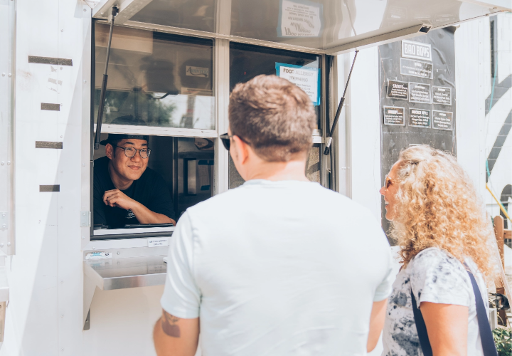 Customers ordering food from Bao Boys Food Truck in Ann Arbor, Michigan.