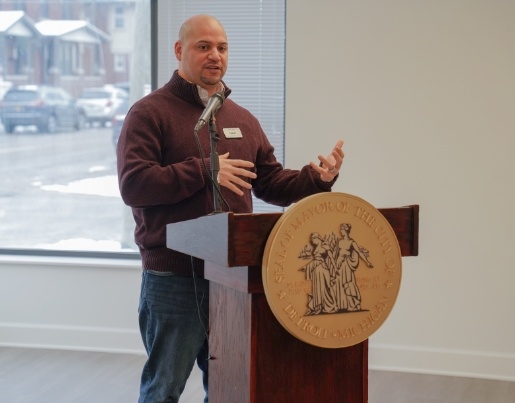 A Lake Trust team member speaks at a podium