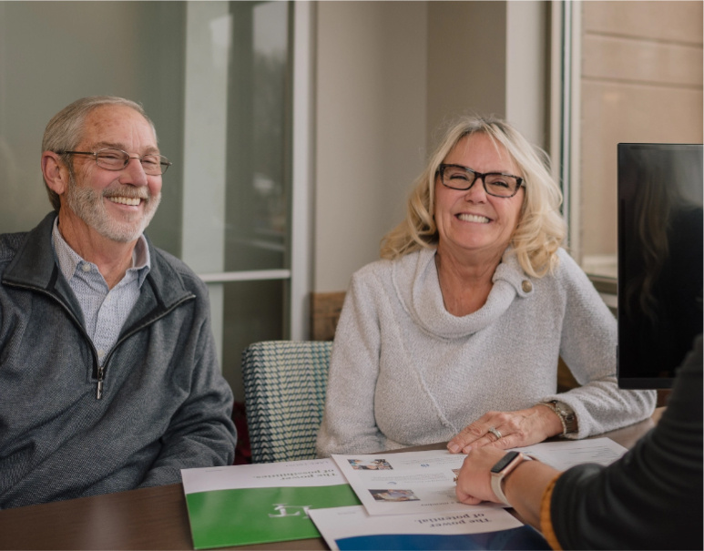 Smiling couple at Lake Trust branch