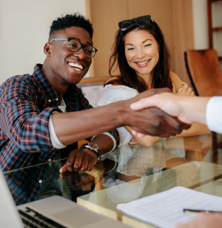 Happy couple closing on their home loan.