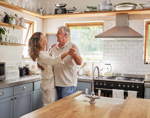 Couple dancing in beautiful and bright kitchen