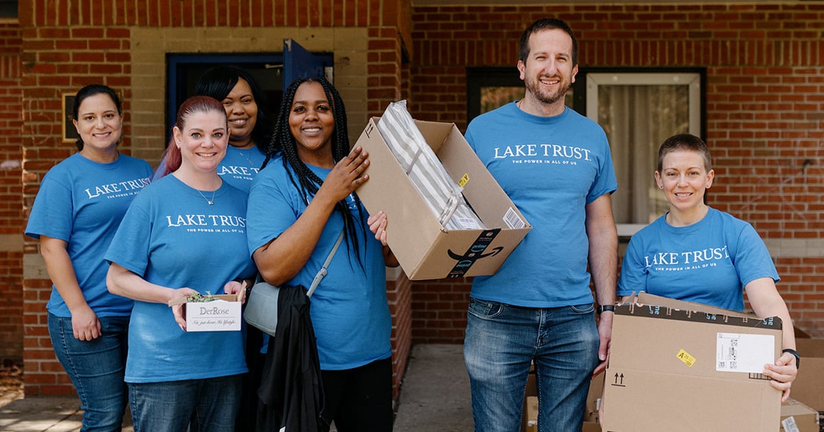 A group of Lake Trust team members volunteering.