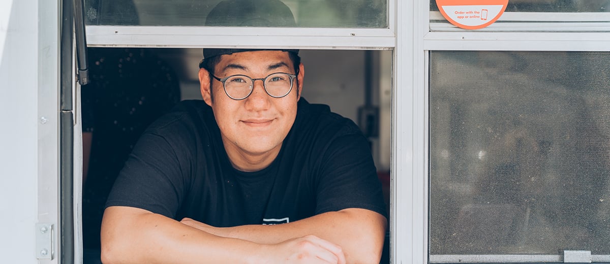 Brian, one of the owners of Bao Boys, looks out through the food truck window 