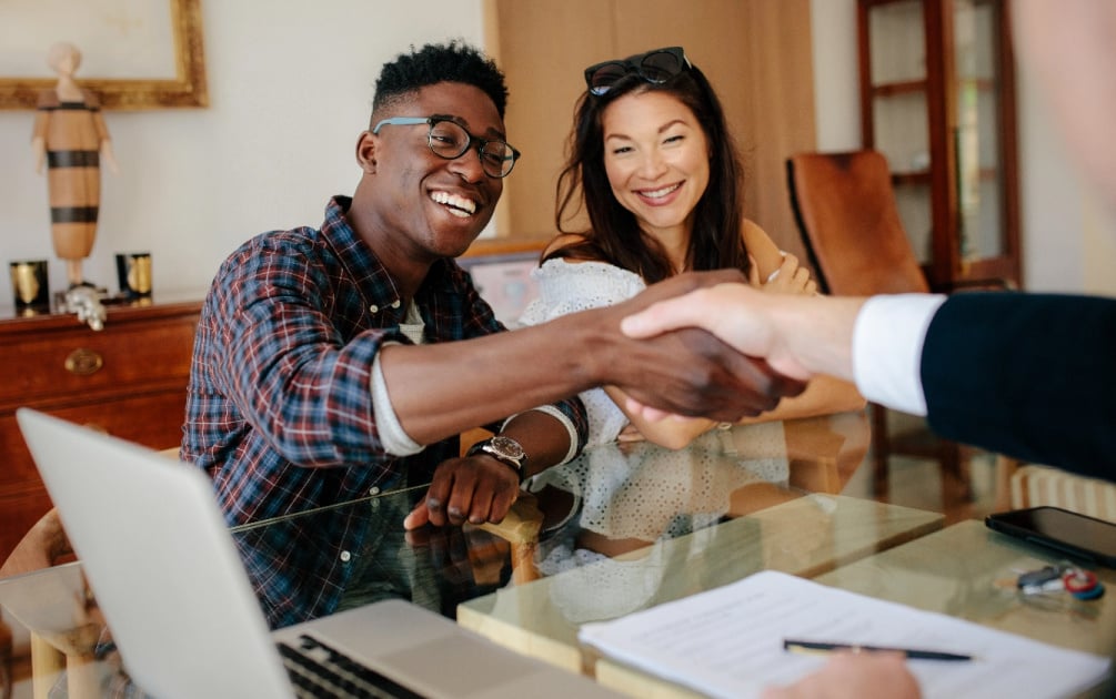 Happy couple closing on their home loan.