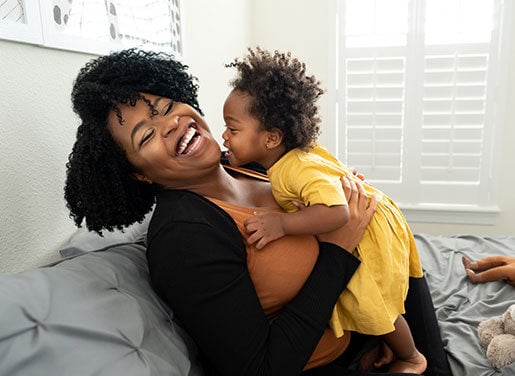 Mom and baby laughing 