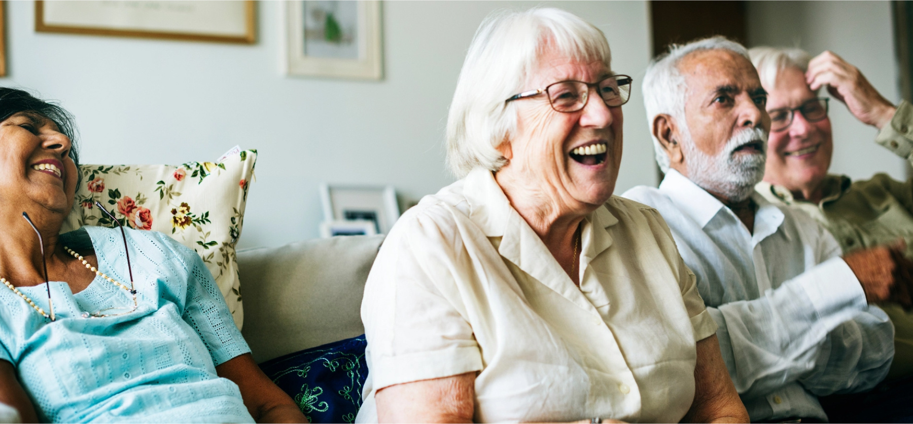 Smiling and laughing group of older friends.