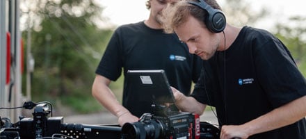 Mixer Media video production team setting up professional camera equipment on location for a client shoot.