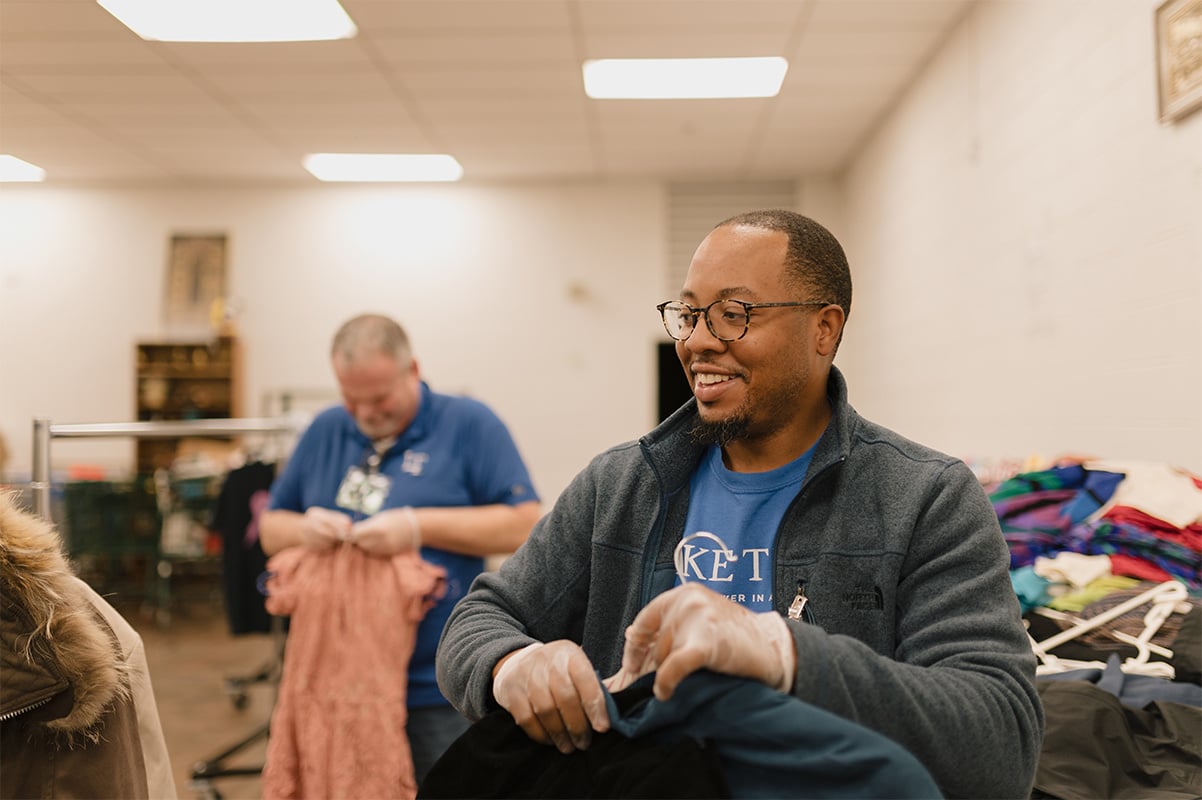 Lake Trust team members sorting clothing donations.