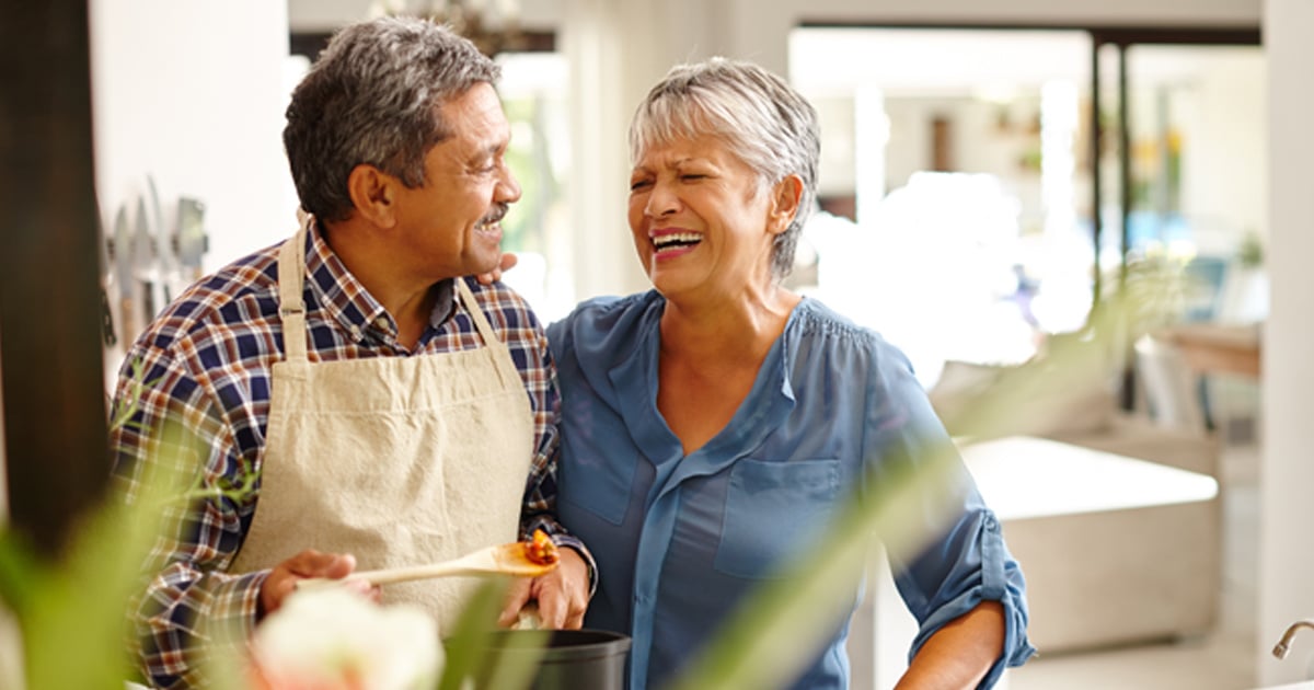 man and woman laughing together