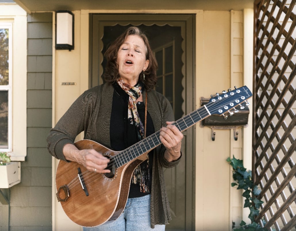 Kat, a Lake Trust member, sings and plays the guitar