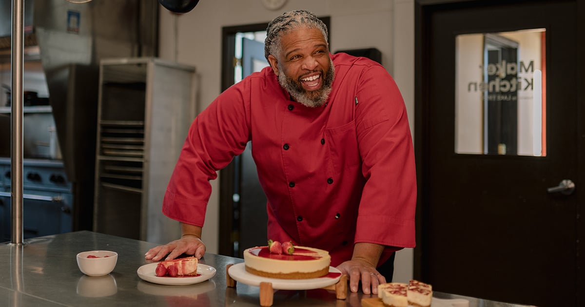 Mr. Leslie Cheesecakes owner, Marcus Leslie, smiling in his kitchen