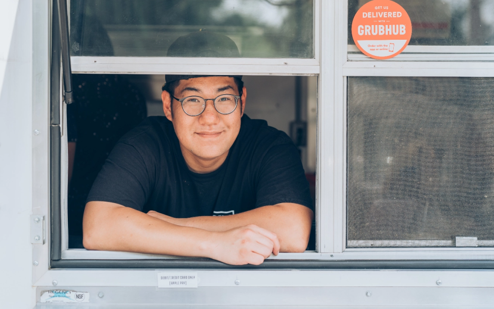 Brian, the owner of Bao Boys, looks out the window of a food truck