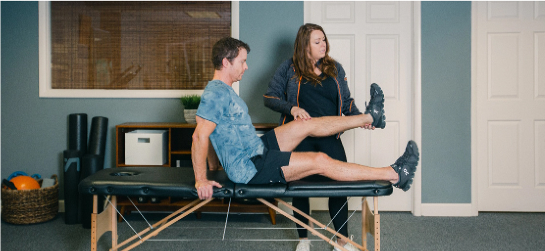 Physical therapist examining patient. 